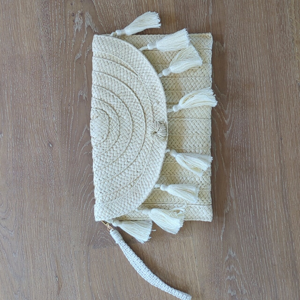 Woven clutch with tassels and removable wrist leash